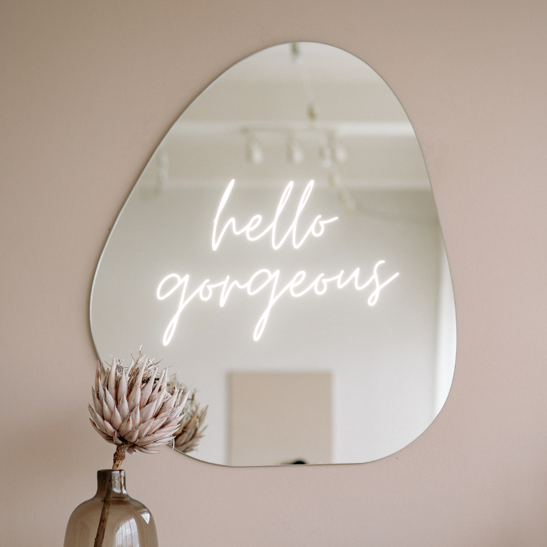 A mirror with the words " hello gorgeous ".